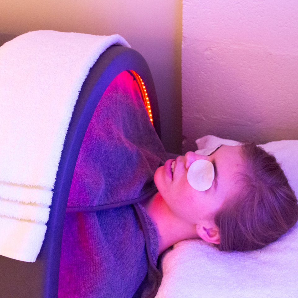 Client receiving infrared therapy at KÚR Health Spa Charlotte NC
