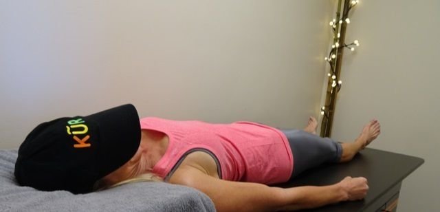 Client on bio-electric magnetic pulse therapy table at KÚR Health Spa Charlotte NC